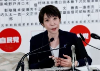 japan s prime minister sanae takaichi leader of the ruling liberal democratic party ldp who has previously suffered a hand injury speaks to the media in front of a board displaying the names of ldp candidates at the ldp headquarters on general election day in tokyo japan february 8 2026 photo reuters