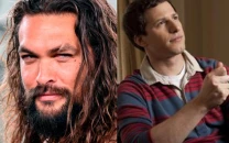 andy samberg recalls wild first meeting jason momoa at snl 50th afterparty