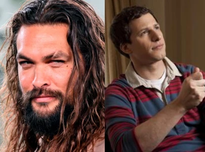andy samberg recalls wild first meeting jason momoa at snl 50th afterparty