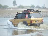 a 4x4 vehicle powers through the indus river during the 14th indus river cross jeep race at hund swabi photo express