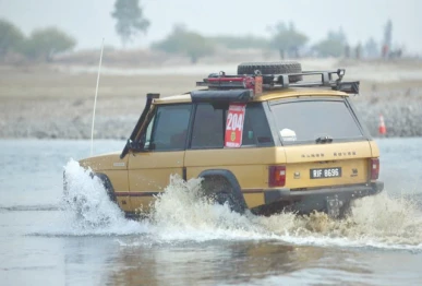 a 4x4 vehicle powers through the indus river during the 14th indus river cross jeep race at hund swabi photo express