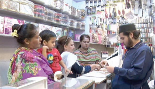 women select artificial jewellery at a shop on tariq road photo express women select artificial jewellery at a shop on tariq road photo express