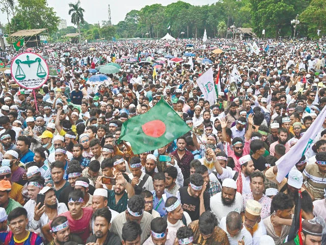 jamaat e islami party leaders and activists wave bangladesh s national flag during a rally in dhaka photo afp