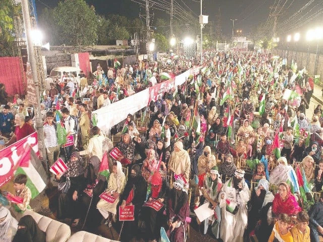supporters wave palestinian and pakistani flags during the gaza march organised by jamaat e islami in lahore photo nni