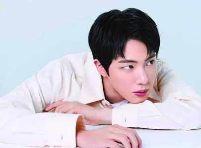 jin steps out of the bts hive with happy