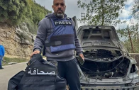al mayadeen journalist jamal al gharabi holds the press vest of one of the two lebanese journalists who were killed by a targeted israeli strike amid escalating hostilities between israel and hezbollah as the u s israeli conflict with iran continues in jezzine in southern lebanon march 28 2026 the sign on the vest reads press picture taken with a mobile phone reuters al mayadeen journalist jamal al gharabi holds the press vest of one of the two lebanese journalists who were killed by a targeted israeli strike amid escalating hostilities between israel and hezbollah as the u s israeli conflict with iran continues in jezzine in southern lebanon march 28 2026 the sign on the vest reads press picture taken with a mobile phone reuters