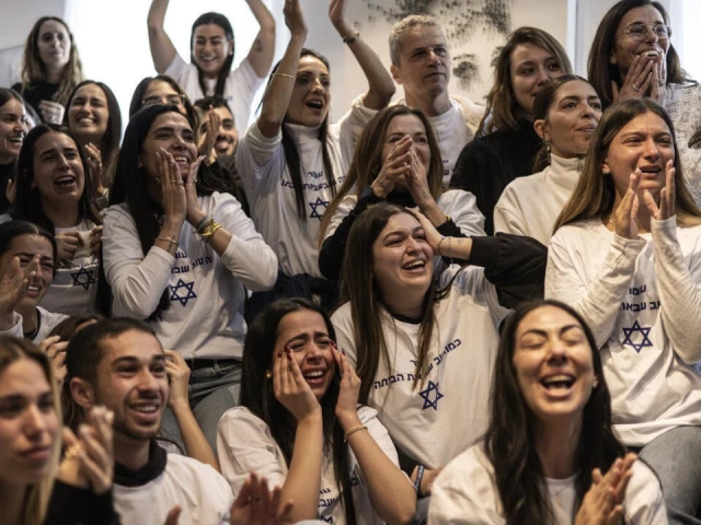friends and family of israeli hostage omer shem tov celebrate as they watch his televised release by hamas at his family home in tel aviv photo afp
