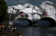 view of the damaged canvas of the temporary artwork la caverne du pont neuf the pont neuf cave conceived by french street artist jr as a tribute to christo and jeanne claude on the pont neuf bridge after strong winds in paris france june 2 2026 reuters sarah meyssonnier