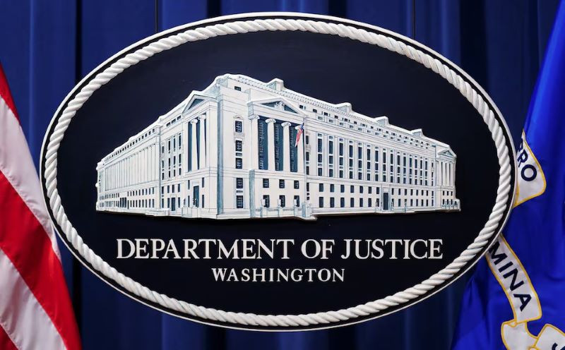 a us justice department logo or seal showing justice department headquarters known as main justice is seen behind the podium in the department s headquarters briefing room before a news conference with the attorney general in washington january 24 2023 photo reuters