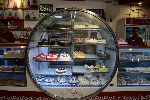 Pakistani Kashmiri bakers waiting for customers inside Nafees Bakers in the Pakistani Kashmir city of Mirpur, which is known as 