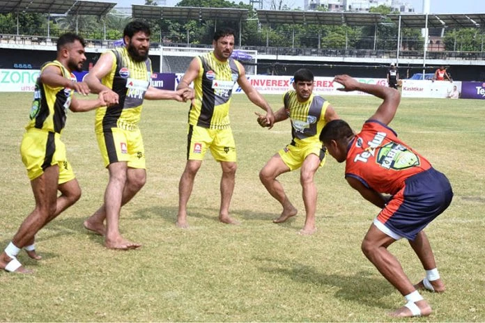 kabaddi players in action during the match between khyber pakhtunkhwa and sindh teams at punjab stadium photo app