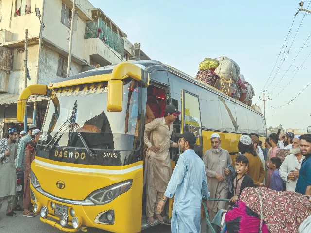 afghan refugees board a bus as they leave for afghanistan at a bus stand in karachi photo afp afghan refugees board a bus as they leave for afghanistan at a bus stand in karachi photo afp