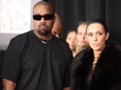 bianca censori wears irony to her upcoming movie premiere accompanied by kanye bianca censori wears irony to her upcoming movie premiere accompanied by kanye