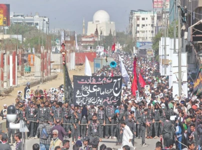 city turns out for youm e ali procession