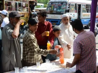 civility volunteers distribute sherbet at a stall on karachi s shahrae faisal photo jalal qureshi express