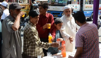 civility volunteers distribute sherbet at a stall on karachi s shahrae faisal photo jalal qureshi express