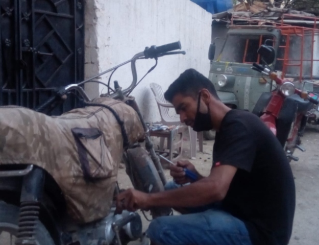 Hailing from low-income locality of Liaquatabad, Ali had run out of cash just three days into the lockdown. PHOTO: EXPRESS