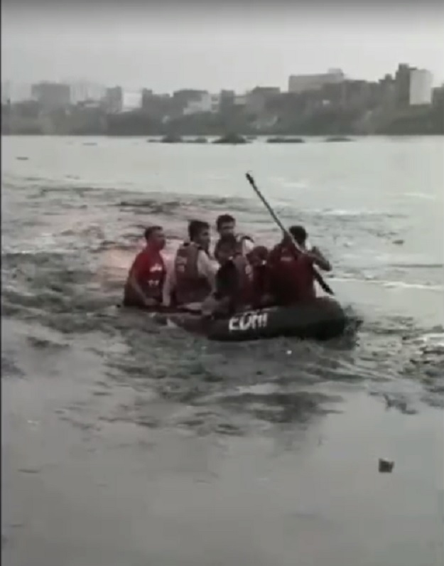 This screengrab shows stranded commuters being brought to safety by rescuers. PHOTO: EXPRESS