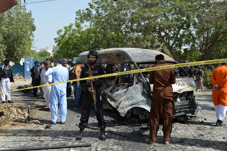 security personnel inspect the blast site of the terrorist attack inside university of karachi april 26 2022 photo xinhua