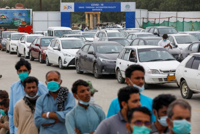 residents line up to receive a vaccine against coronavirus disease covid 19 at a drive through vaccination facility photo reuters residents line up to receive a vaccine against coronavirus disease covid 19 at a drive through vaccination facility photo reuters