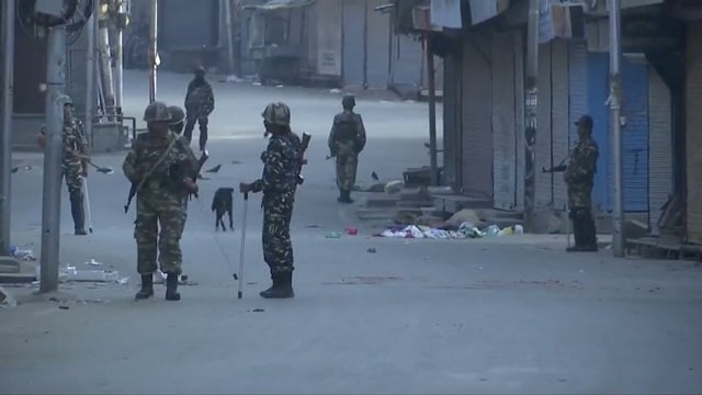 Indian security personnel patrol a street in Srinagar. -Reuters