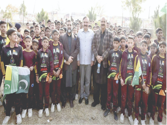 mna tariq fazal chaudhry stands alongside pakistan sweet homes chairman zamurud khan ti and the children on kashmir solidarity day as they mark the occasion by demonstrating their support for the oppressed people of occupied kashmir in the federal capital photo express