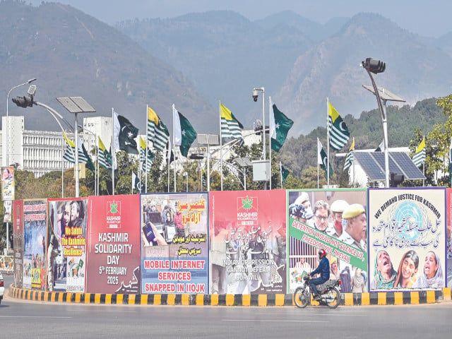 banners highlighting the kashmiri people s right to self determination are displayed at a roundabout along a beautiful thoroughfare in the federal capital photo app