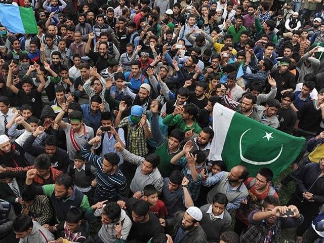 kashmiri protestors wave pakistan s flag at a protest photo afp file