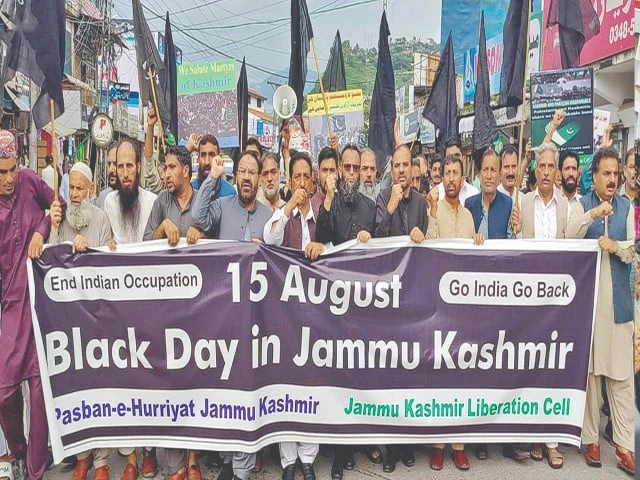 protesters belonging to pasban e hurriyat jammu and kashmir shout slogans as they march on a road in muzaffarabad photo nni