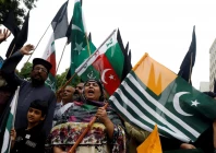 people chant slogans and carry azad kashmir s flag to observe black day during a protest in karachi on august 15 2019 photo reuters