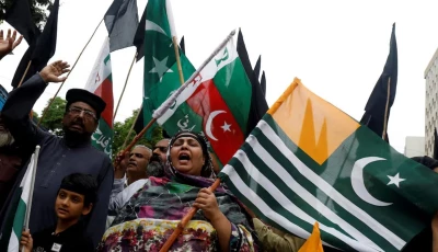 people chant slogans and carry azad kashmir s flag to observe black day during a protest in karachi on august 15 2019 photo reuters