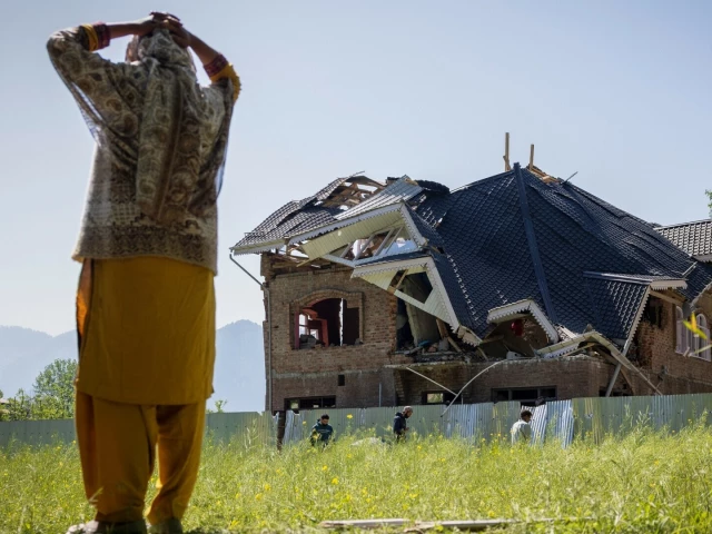 a woman stands next to amir nazir wani s family house which was destroyed by the indian authorities in khasipora village in tral occupied kashmir on april 27 2025 reuters adnan abidi a woman stands next to amir nazir wani s family house which was destroyed by the indian authorities in khasipora village in tral occupied kashmir on april 27 2025 reuters adnan abidi