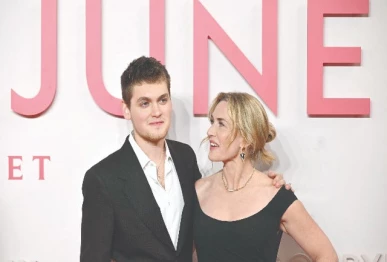 british actress kate winslet poses with her son actor and writer joe anders on the red carpet upon arrival at the premiere of her film goodbye june in central london photo afp