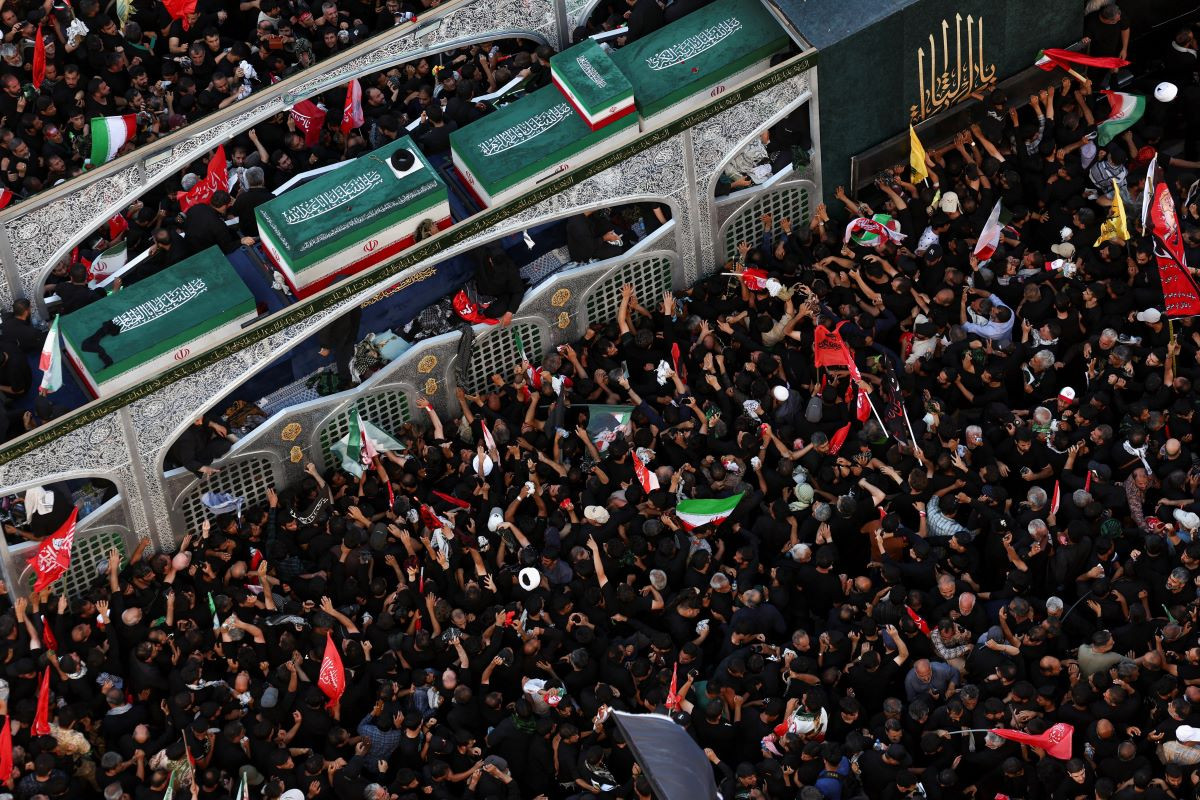 Mourners gather around a vehicle transporting the coffin of Iran's late Supreme Leader Ayatollah Ali Khamenei, who was killed on February 28 in Israeli and US airstrikes, and coffins of his family members, on the day of his burial, in a culmination of a mass funeral, in Mashhad, Iran, July 9, 2026.PHOTO: REUTERS