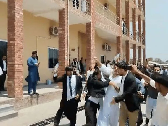 video shows a lawyer punching bushra s ex husband khawar maneka knocking him to the ground screengrab video shows a lawyer punching bushra s ex husband khawar maneka knocking him to the ground screengrab
