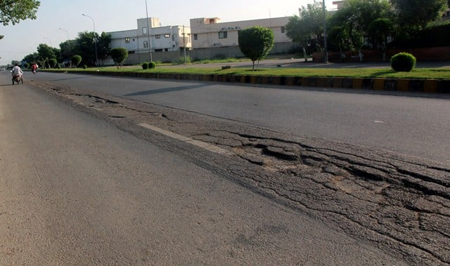 the state of many main thoroughfares in the dha cbc area is appalling photo athar khan express
