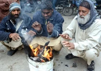 people warming their hands in karachi photo app people warming their hands in karachi photo app
