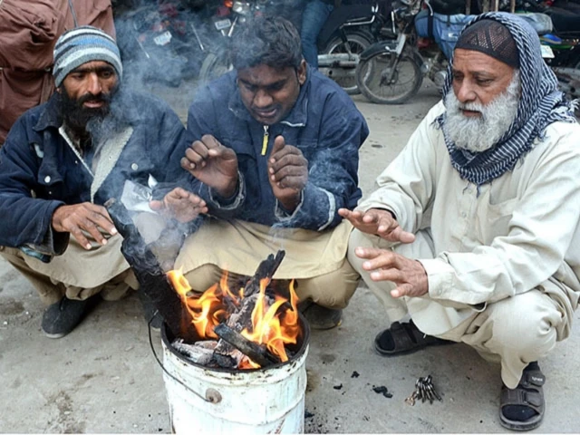 people warming their hands in karachi photo app