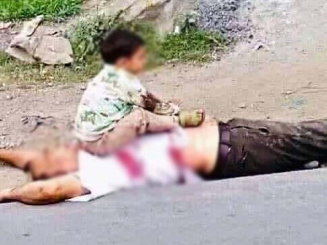 the heartbreaking photo of the child sitting on the body of his dead grandfather was widely shared on social media photo courtesy hindustan times