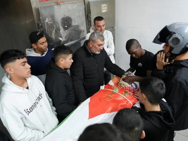 relatives of one of two palestinians who were killed in an israeli raid react near their body ahead of their funeral at a hospital in ramallah in the israeli occupied west bank november 21 2025 photo reuters