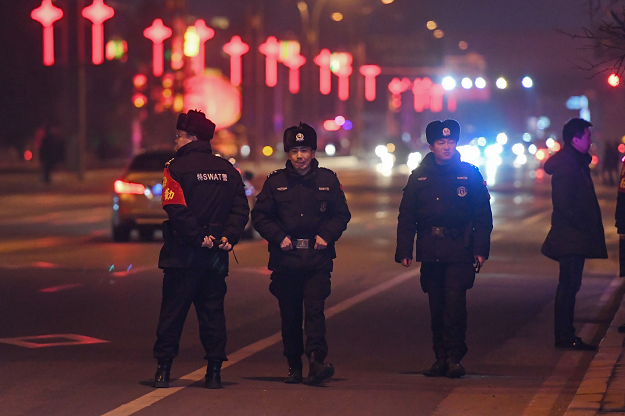 Chinese police block off a road leading to the waterfront area near the Sino-Korean Friendship Bridge shortly before the arrival of the armored train of North Korean leader Kim Jong Un, in Dandong in China's northeast Liaoning province, on February 23, 2019. PHOTO: AFP