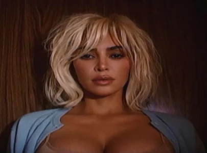 kim kardashian releases santa baby cover featuring macaulay culkin