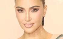 kim kardashian weighs legal move to change kids last names