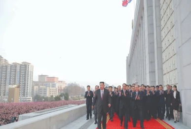north korean leader kim jong un c heading towards the venue for a commemorative performance following the conclusion of the first session of the 15th supreme people s assembly in pyongyang photo afp