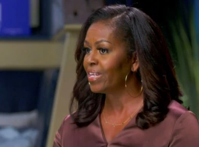 michelle obama reveals she got 10 piercings in one sitting michelle obama reveals she got 10 piercings in one sitting