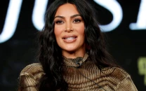 kim kardashian trips and falls into a bush at vanity fair oscars party