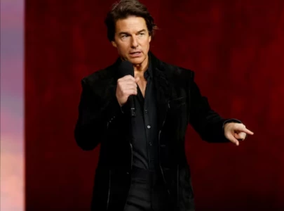 tom cruise transforms into eccentric cat loving billionaire in digger trailer