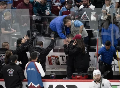 glass shatters over los angeles kings bench after fans pound on boards during playoff game