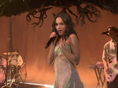 olivia rodrigo debuts begged on snl connor storrie makes surprise appearance to introduce her
