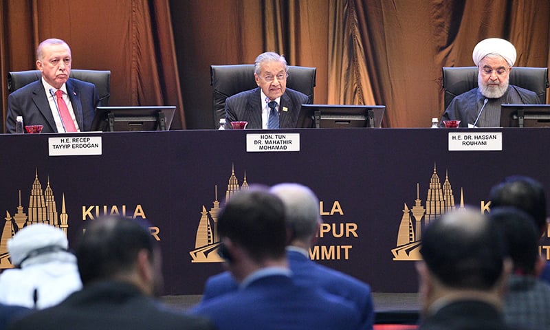 Malaysia's Prime Minister Mahathir Mohamad, Turkey's President Recep Tayyip Erdogan and Iranian President Hassan Rouhani react during a Kuala Lumpur Summit roundtable session in Kuala Lumpur, Malaysia December 19, 2019. Malaysia Department of Information/Handout via REUTERS ATTENTION EDITORS - THIS IMAGE WAS PROVIDED BY A THIRD PARTY. MANDATORY CREDIT. NO RESALES. NO ARCHIVES.